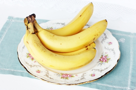 A photo of a bunch of bananas on a vintage Royal Albert plate