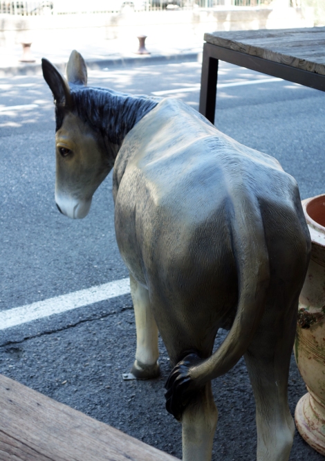 Donkey statue outside antiques shop in L'isle-sur-la-Sorgue