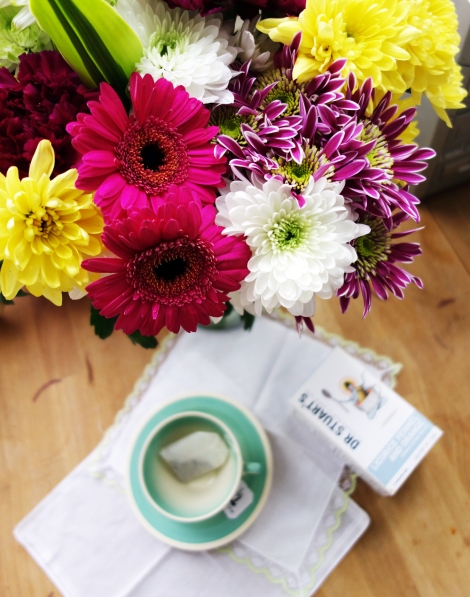 A photo of Flowers with Susie Cooper tea cup and saucer